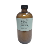 Bottle of Mint Floor Wash with a label on a white background