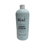 Bottle of Mint laundry detergent on a white background